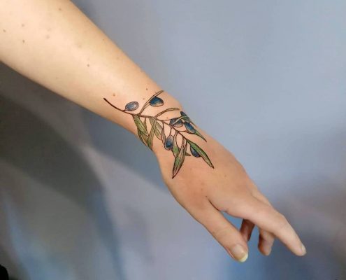LED Travel Series Greece Olive Branch fine line dotwork tattoo by artist Cesarina Gretha (Sanne Bosscher)
